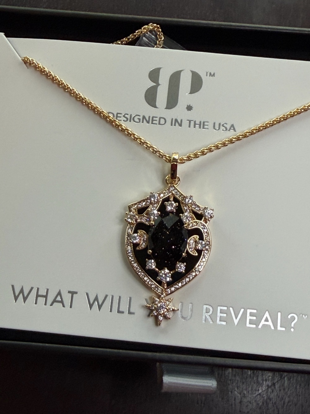 Gold-Tone Black Crystal Pendant Necklace with Decorative Accents